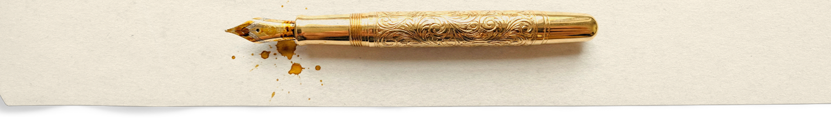 Fountain pen on a beige background